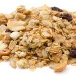 Pile,Of,Granola,Cereal,With,Raisins,And,Nuts,Isolated,On