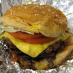 What is the difference between Five Guys cheeseburger and little cheeseburger?